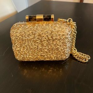 Gold sequined clutch, with hidden chain.
